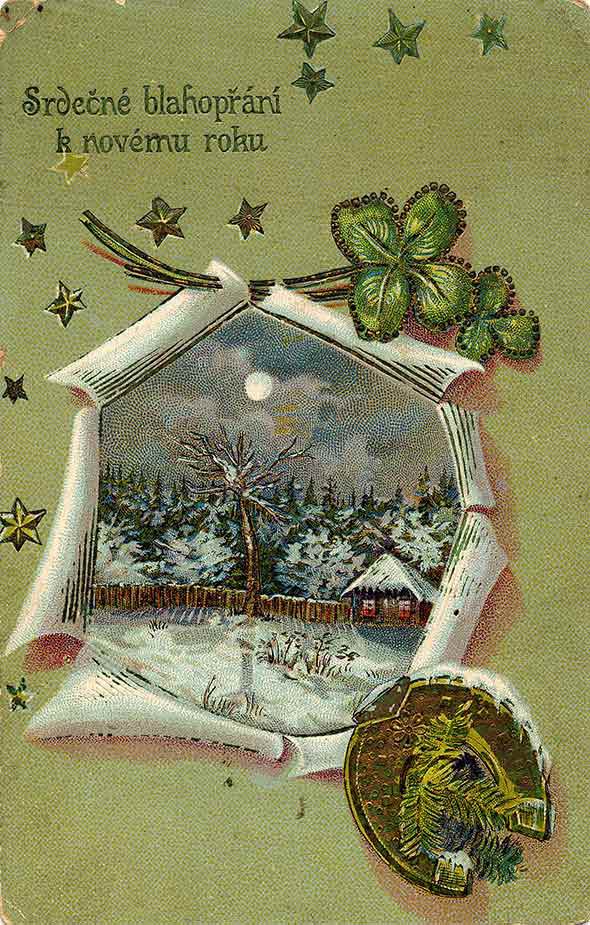 Novoroční přání, nahoře text Srdečné blahopřání k novému roku, zimní zasněžená krajina s domem, okolo hvězdy, podkova a čtyřlístky, zlacení, vytlačování, kolem roku 1900